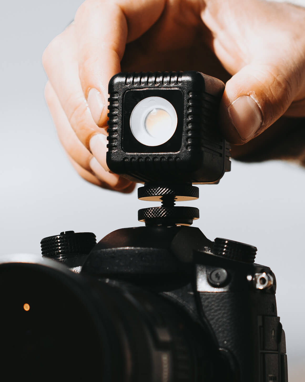 Black 1.5" Lume Cube 2.0 Waterproof LED on shoe mount. LC-SB-VC2-1-2PACK