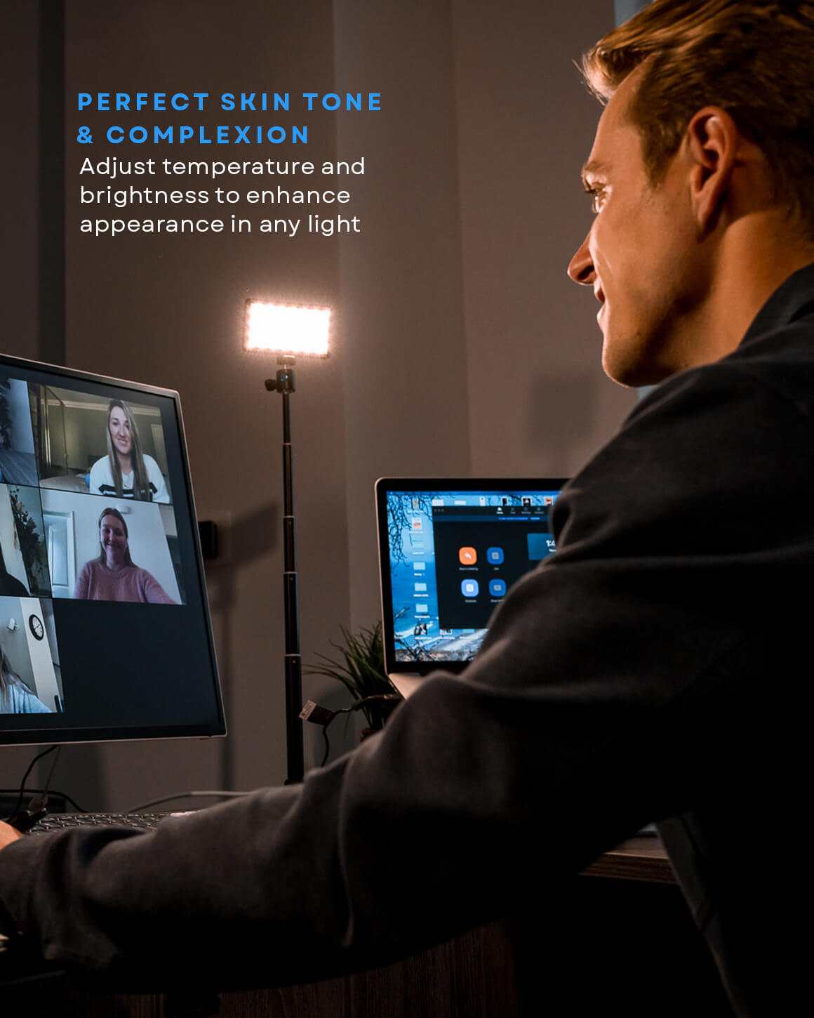 Man at desk using Lume Cube Broadcast Lighting Kit to enhance appearance on video call.