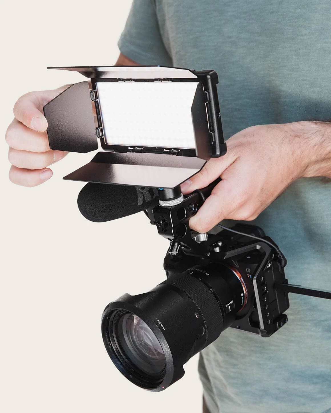 Camera with RGB Panel Pro and black metal 4-slat barn doors mounted on top. LC-PPACC