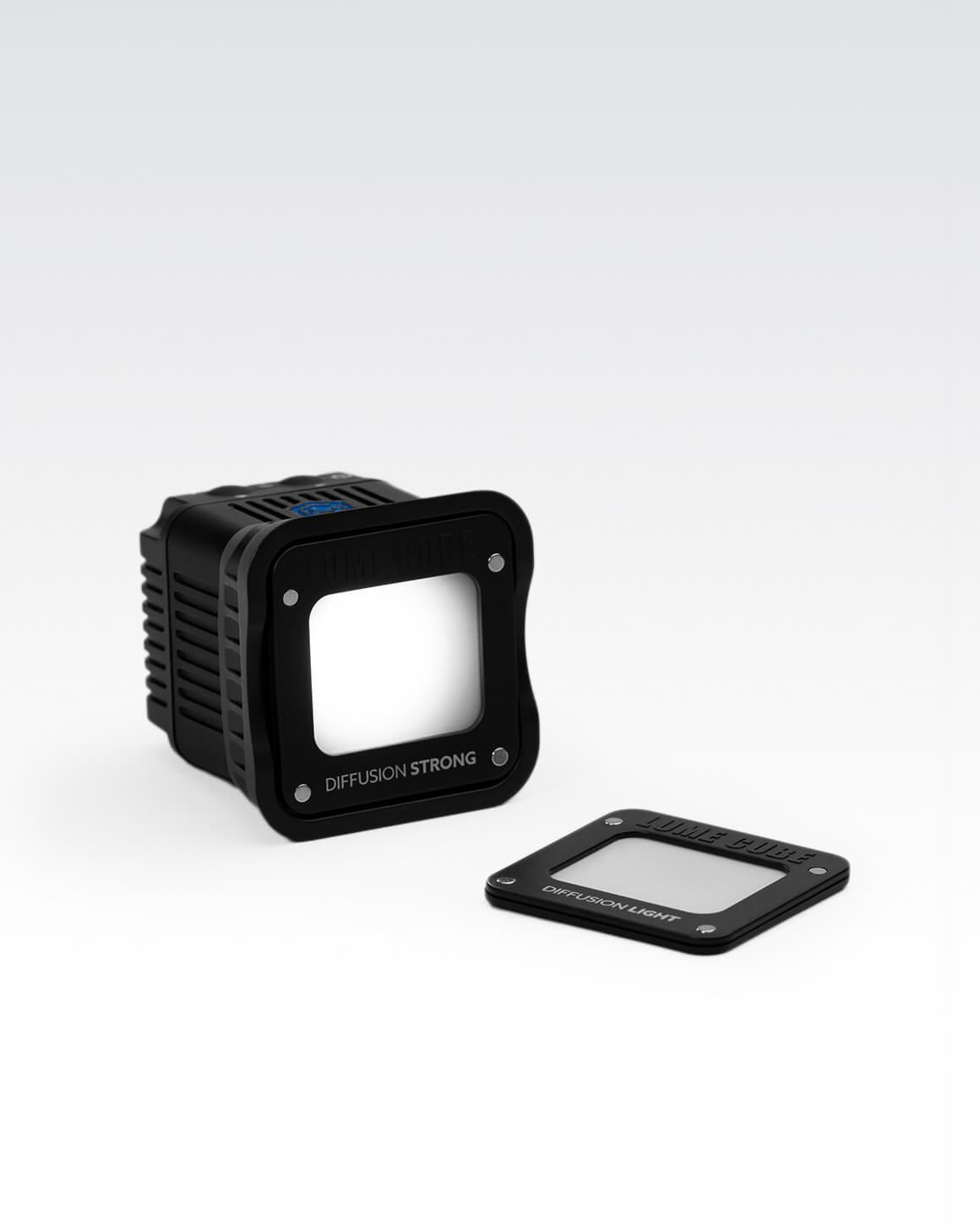 Lume Cube 2.0 with magnetic mounts and diffuser on white background