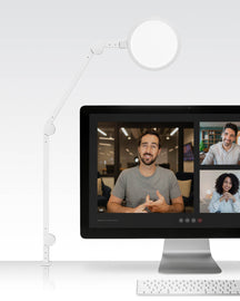 White adjustable LED magnifying lamp mounted for video calls, ideal for detailed tasks and lighting.