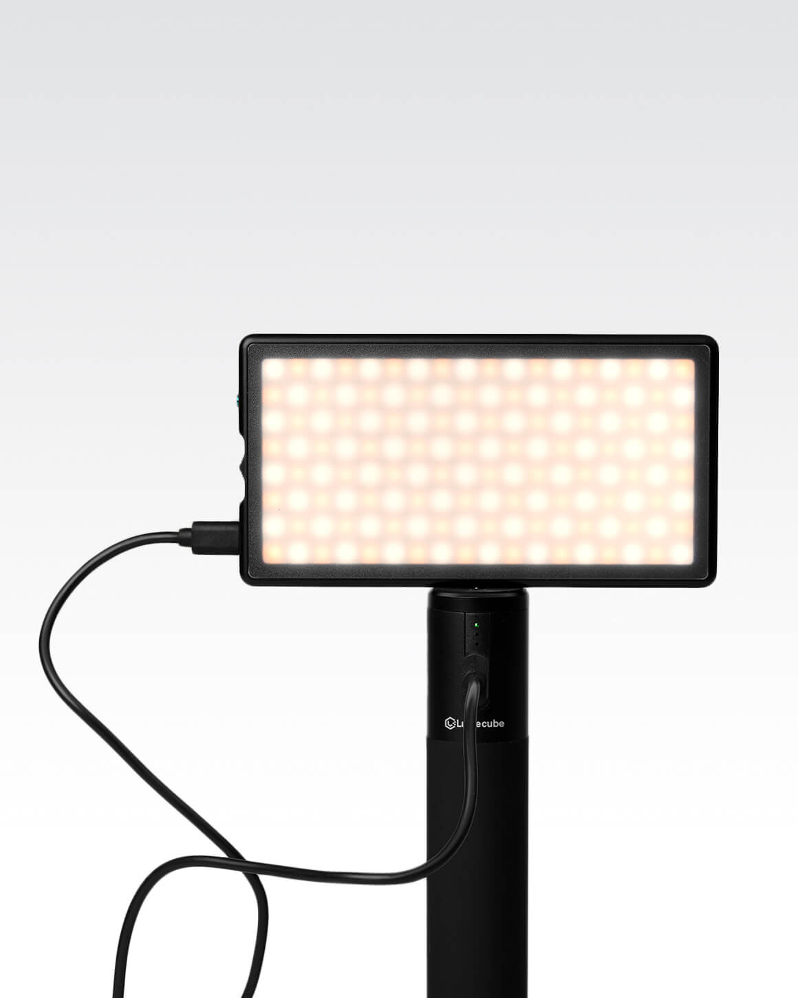 Lume Cube Power Grip Portable Battery with LED RGB Panel Go mounted on top.