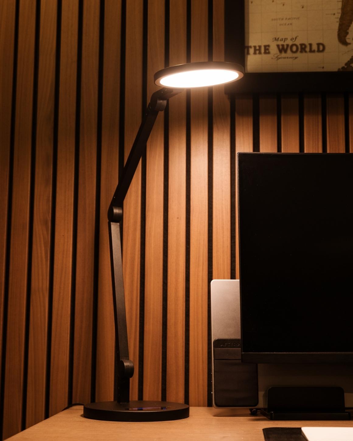Lume Cube Edge Light With Base on Desk in Darkened Room