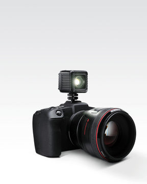 Sony camera with black 1.5" Lume Cube 2.0 Waterproof LED mounted on top.