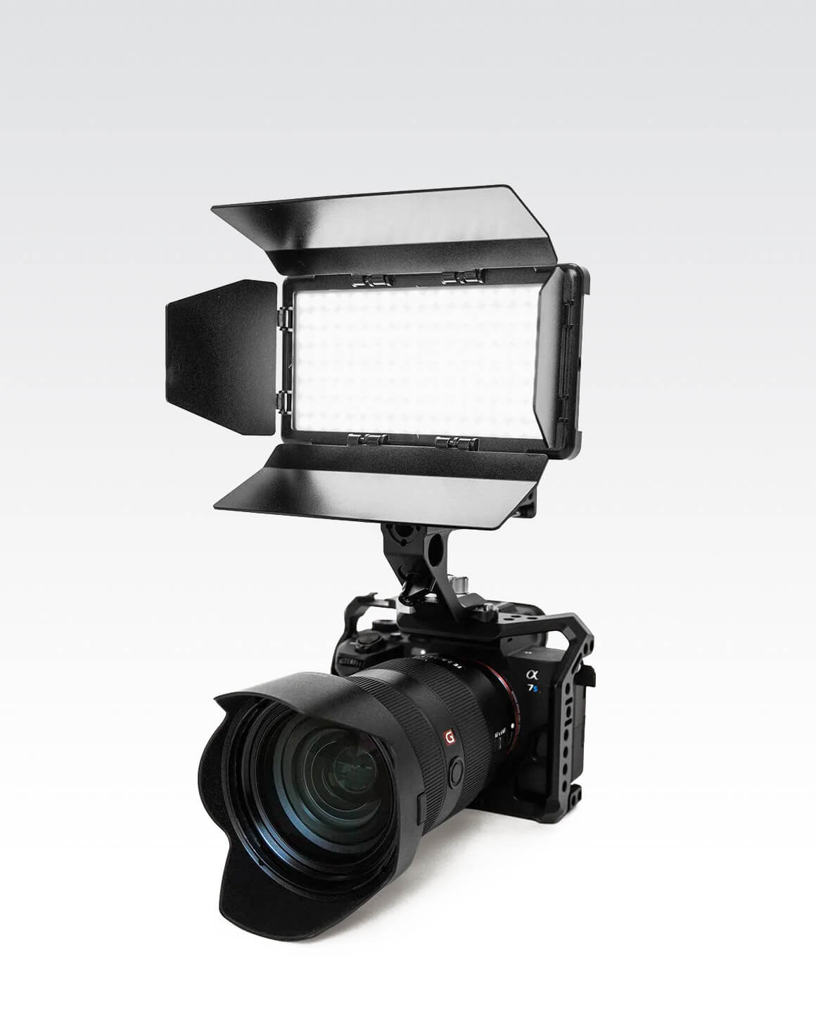 Camera with RGB Panel Pro and black metal 4-slat barn doors mounted on top. LC-SB-PRO2T60ACC