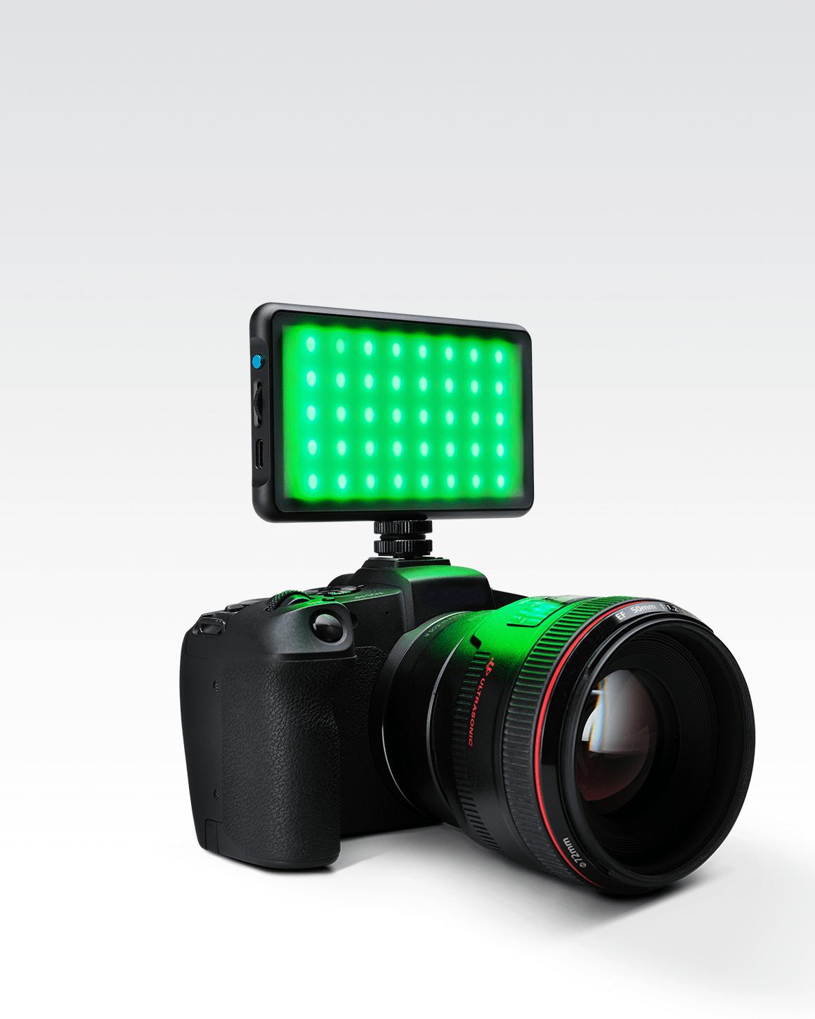 Lume Cube RGB Panel Go mounted on Sony camera with Green LEDs glowing.