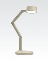 Adjustable beige desk lamp with a modern design, perfect for home or office use.