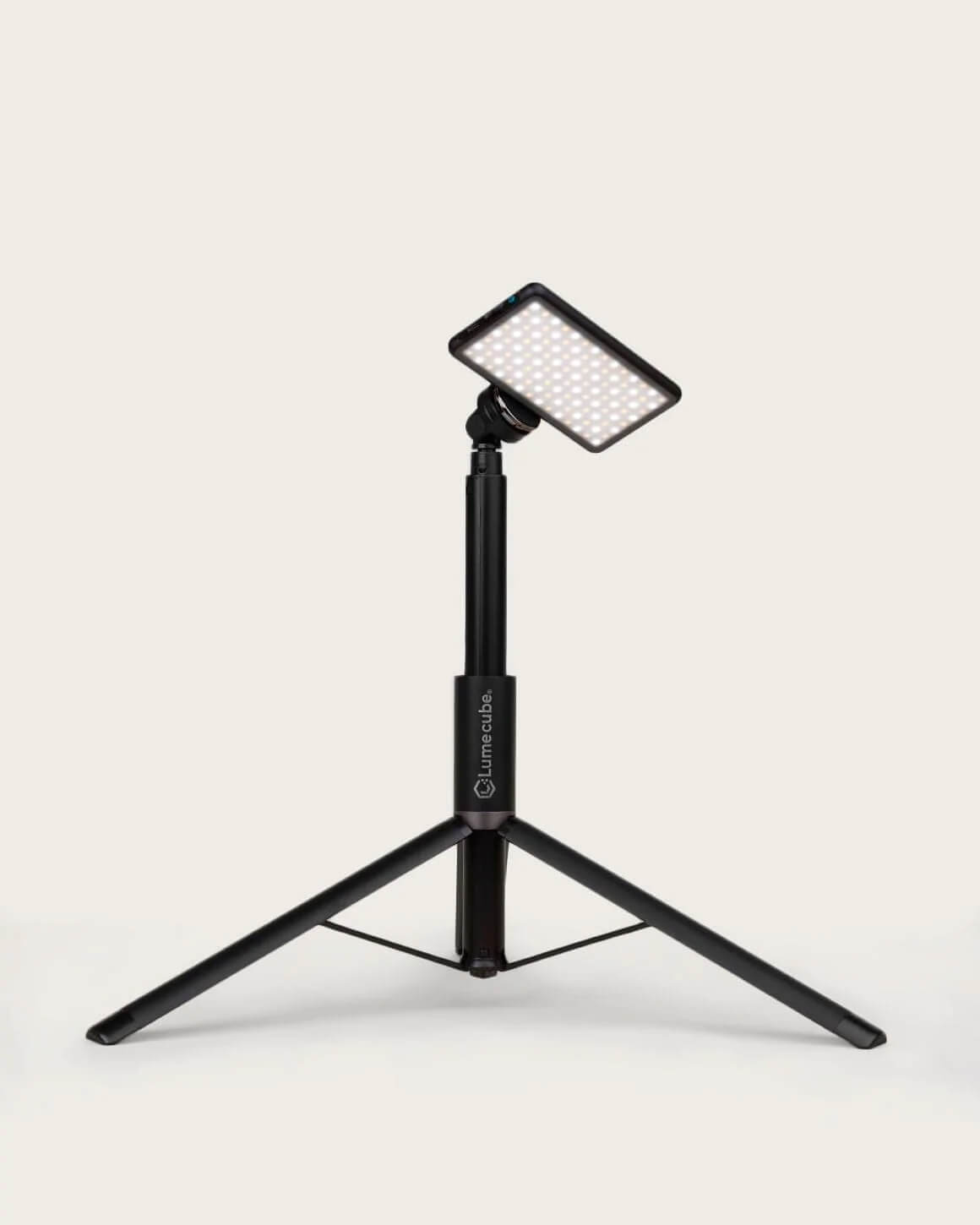 Black metal Lume Cube Adjustable Light Stand in shortest setup with a tilted LED RGB Panel Pro attached.