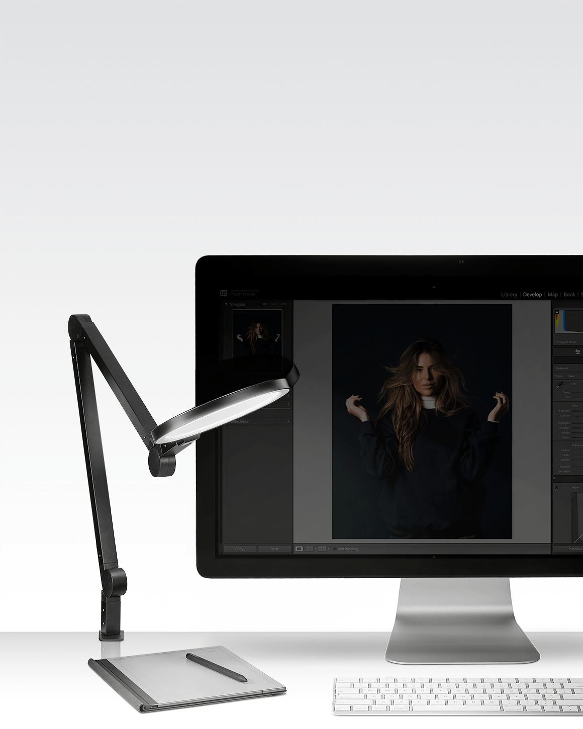 Black Lume Cube Edge Light with all 5 pivot points engaged to precisely direct light on editing bay.