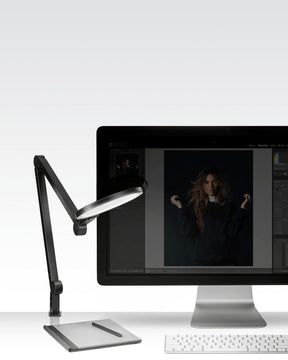Black Lume Cube Edge Light with all 5 pivot points engaged to precisely direct light on editing bay.