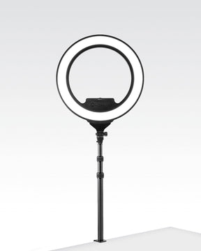 Black Edge-Mounted Light Stand with a Lume Cube Cordless Ring Light Pro attached.