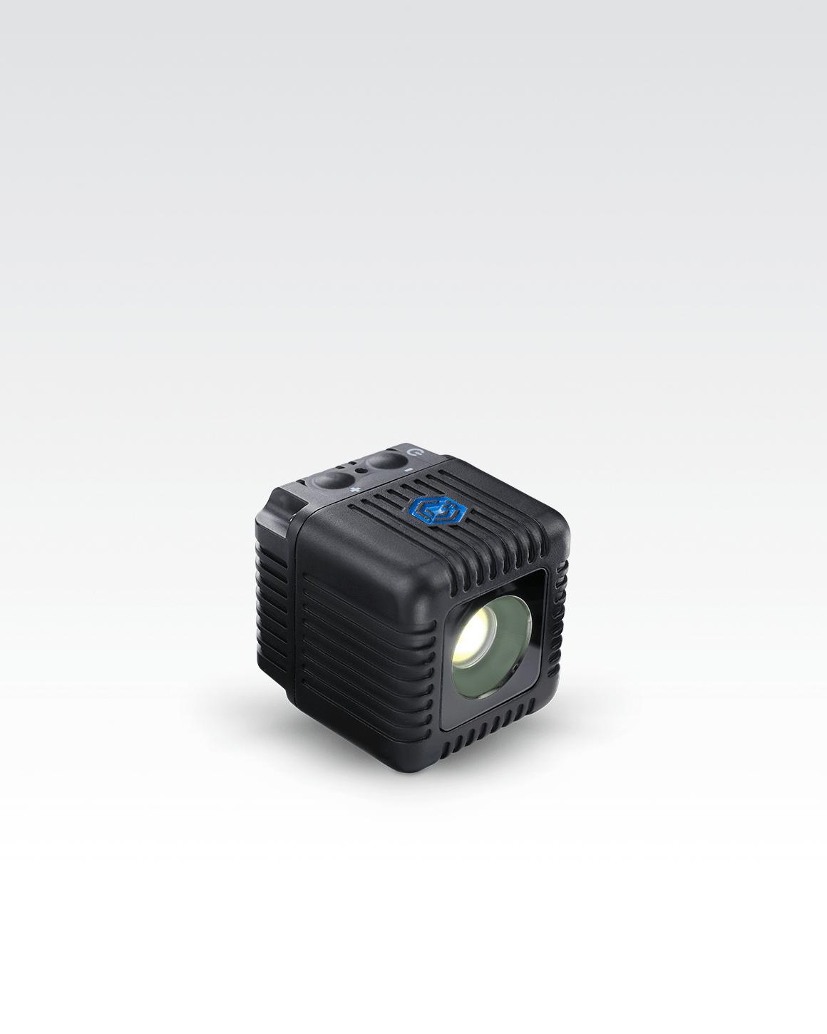 Close shot of Lume Cube 2.0 Waterproof LED showing + and - and power buttons.