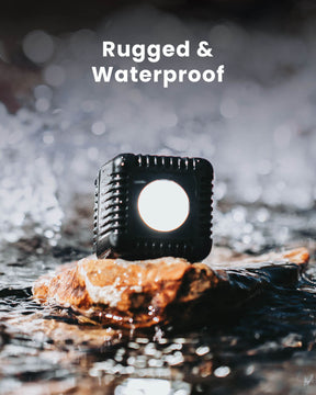 Rugged & Waterproof.  Lume Cube on a rock in a river.