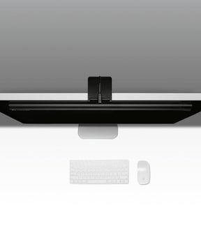 Top-down view of black metal Lume Cube Monitor Light Bar atop Desktop monitor.