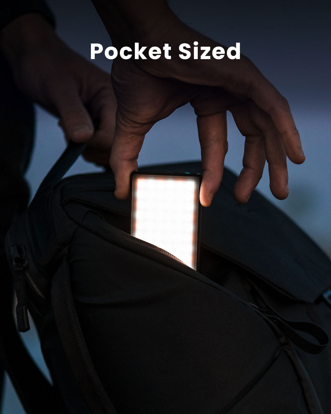 Pocket-Sized. Person slipping credit-card-sized Lume Cube Panel Mini LED into side pocket of backpack to show ultimate portability.