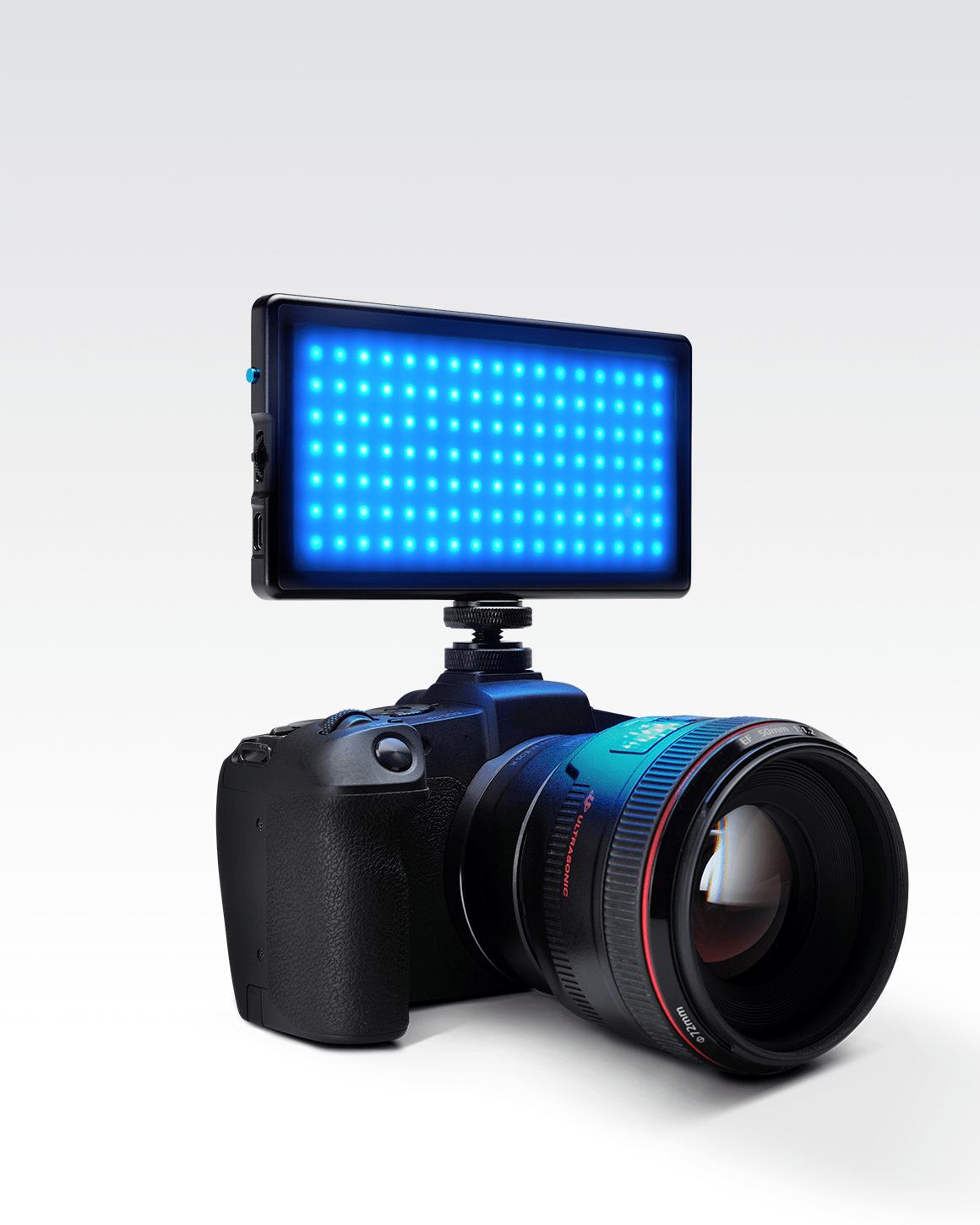 Lume Cube RGB Panel Pro mounted to black Sony camera with blue LEDs glowing.