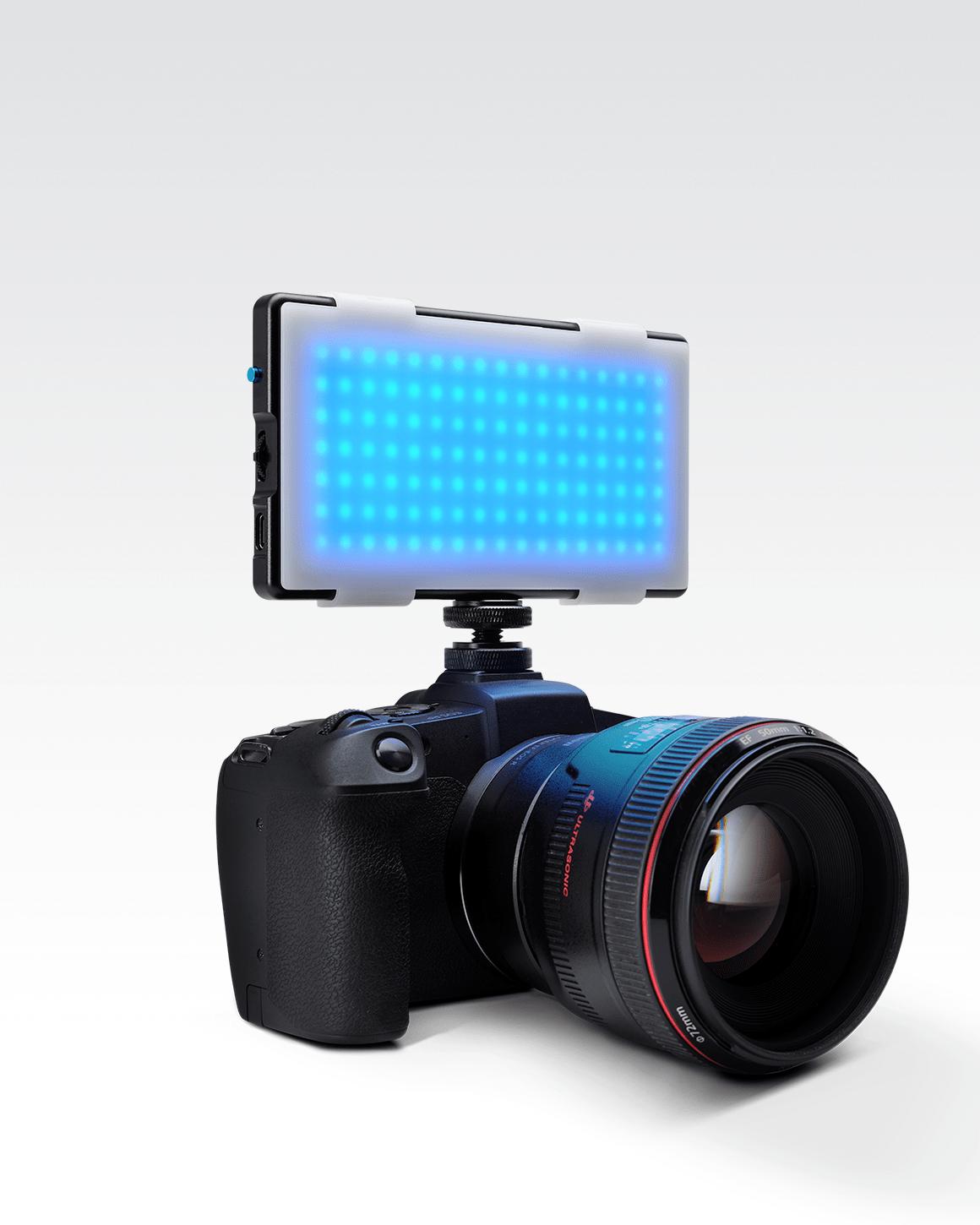 Lume Cube RGB Panel Pro mounted to DSLR camera with plastic white snap on light diffuser attached.