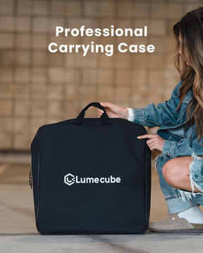 Professional Carrying Case. Woman crouching next to custom black carry case for the comeplete Lume Cube Cordless Ring Light Pro kit.