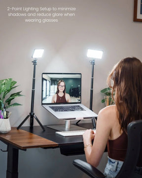 Woman at desk using 2 Lume Cube Broadcast Lighting Kits to remove glare on glasses during video call.