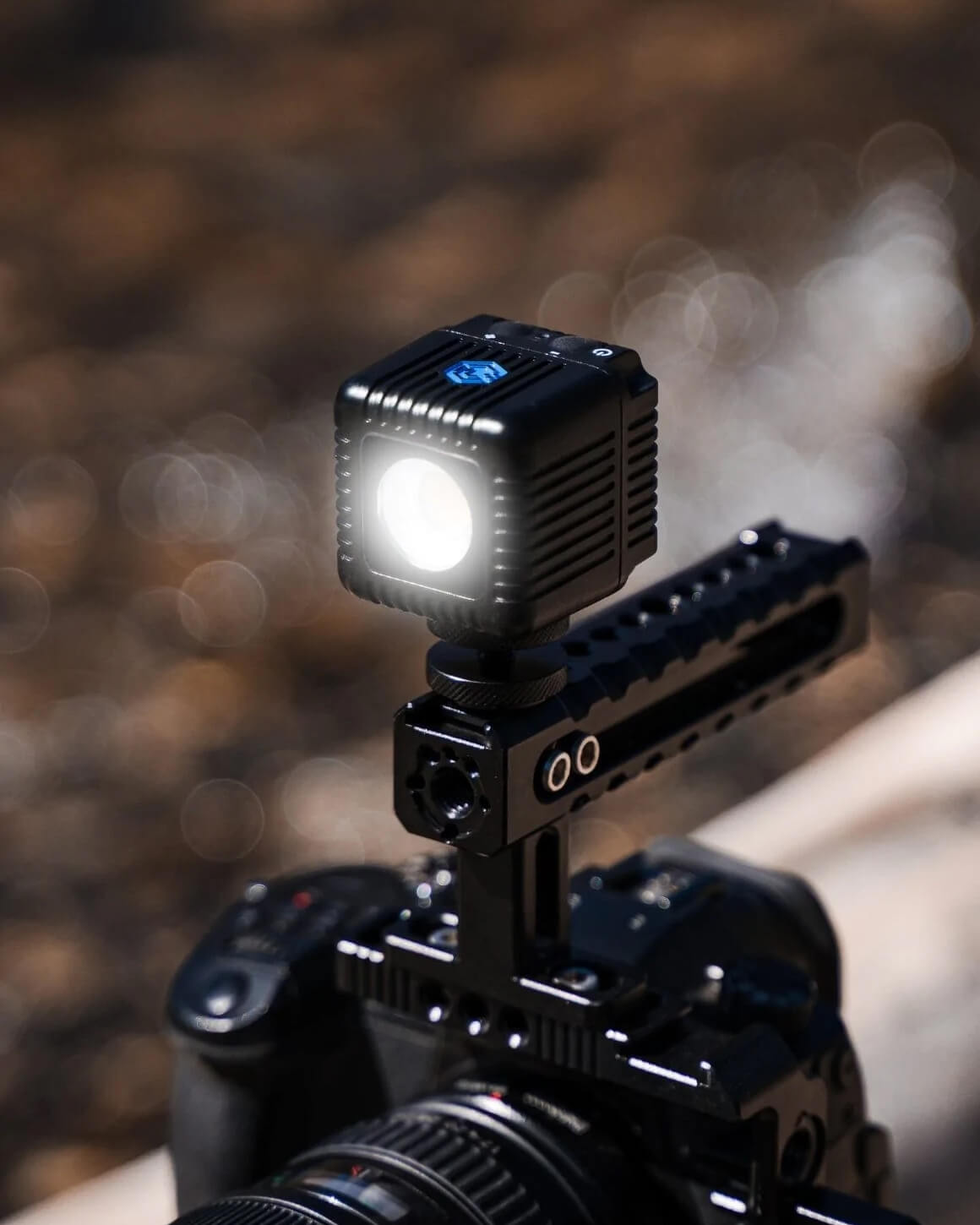 Black 1.5" Lume Cube 2.0 Waterproof LED attached to black jig on camera.