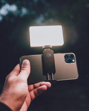 Smartphone with Lume Cube Smarphone Clip for Lighting holding a Panel Mini